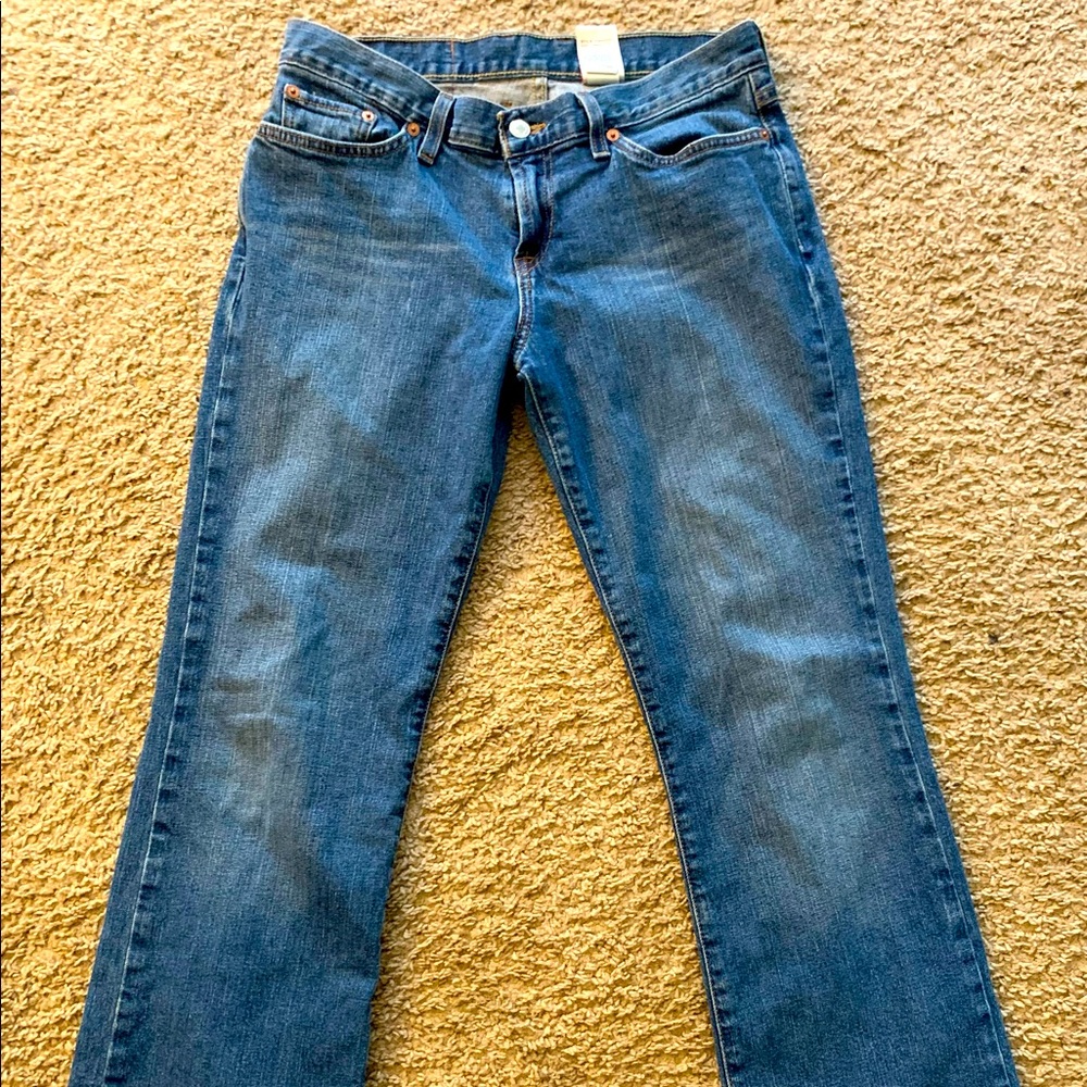 Lucky Jeans. Mid rise Flare Distressed cuffs.